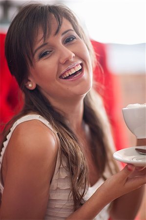 picture of woman drinking coffee - Woman with milk mustache in cafe Foto de stock - Sin royalties Premium, Código: 614-06537174