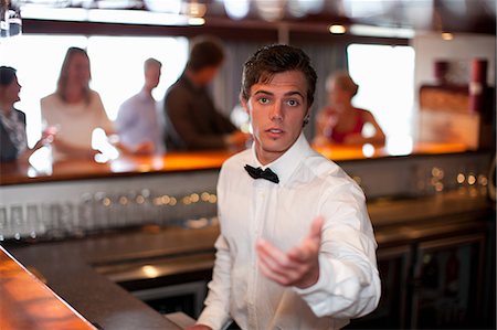 restaurant customer services - Waiter taking order at restaurant bar Stock Photo - Premium Royalty-Free, Code: 614-06537216
