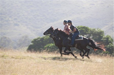 running horse - Couple riding horses in rural landscape Stock Photo - Premium Royalty-Free, Code: 614-06537223