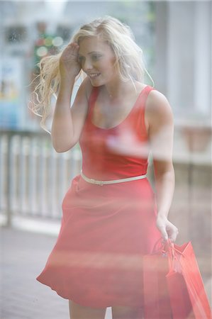 shopping centre exterior - Woman window shopping on street Stock Photo - Premium Royalty-Free, Code: 614-06537344