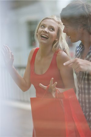 Couple window shopping together Stock Photo - Premium Royalty-Free, Code: 614-06537347