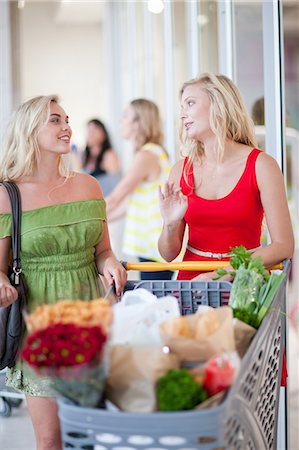 storefronts with flowers - Women pushing shopping cart Stock Photo - Premium Royalty-Free, Code: 614-06537355