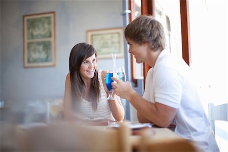 Couple having cocktails in restaurant Stock Photo - Premium Royalty-Free, Code: 614-06537390