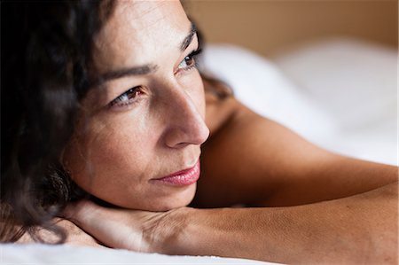 dark haired woman - Close up of woman's serious face Stock Photo - Premium Royalty-Free, Code: 614-06537416