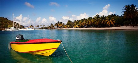 sailboat beach - Colorful boat in tropical water Stock Photo - Premium Royalty-Free, Code: 614-06537419