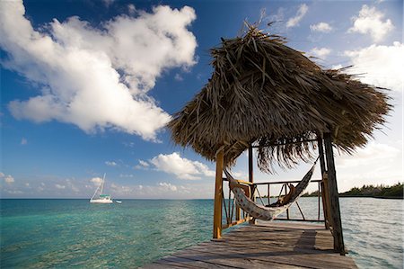 destination white lights - Woman in hammock on tropical water Foto de stock - Sin royalties Premium, Código: 614-06537526