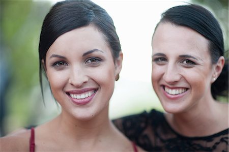 portrait of smiling two women - Women smiling together outdoors Stock Photo - Premium Royalty-Free, Code: 614-06624003