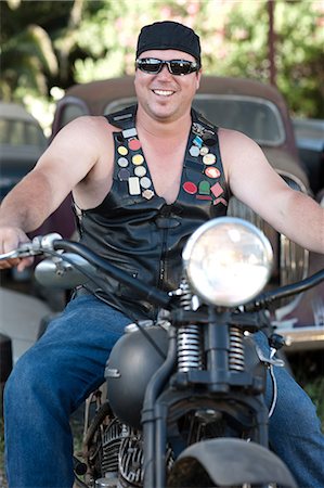 sunglasses and bandana - Man in leather vest on motorcycle Stock Photo - Premium Royalty-Free, Code: 614-06624142