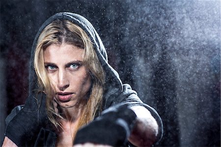 portrait woman focused - Boxer training in gym Stock Photo - Premium Royalty-Free, Code: 614-06624314