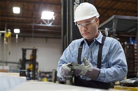 safety glasses - Worker with gloves in metal plant Stock Photo - Premium Royalty-Free, Code: 614-06624475