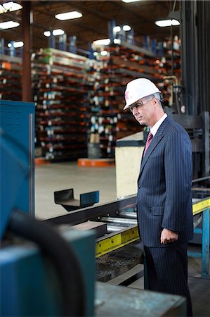 Businessman working in metal plant Stock Photo - Premium Royalty-Free, Code: 614-06624496