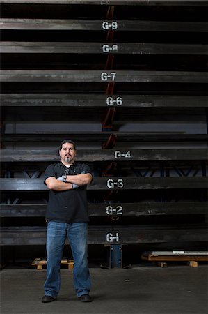 Worker standing in metal plant Photographie de stock - Premium Libres de Droits, Code: 614-06624518