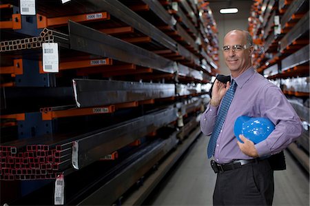 se dégarnir - Businessman standing in metal plant Photographie de stock - Premium Libres de Droits, Code: 614-06624548