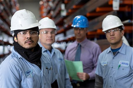 Workers and businessman in metal plant Foto de stock - Sin royalties Premium, Código: 614-06624557