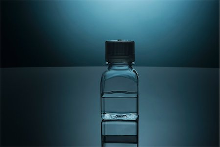 simsearch:649-08119128,k - Glass bottle of clear liquid Stock Photo - Premium Royalty-Free, Code: 614-06624604