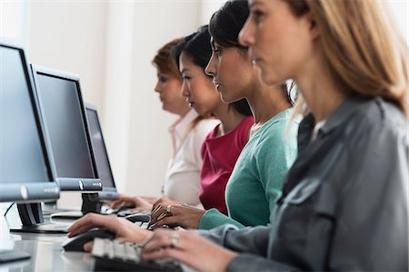 Businesswomen working at computers Stock Photo - Premium Royalty-Free, Code: 614-06624655