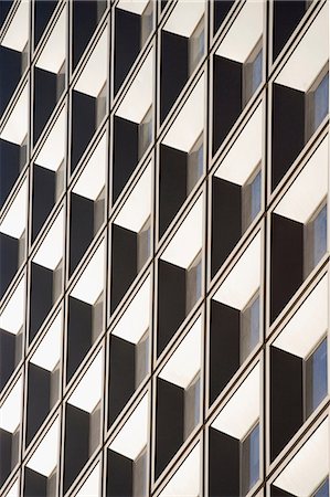 repetition buildings - Tilted view of skyscraper windows Stock Photo - Premium Royalty-Free, Code: 614-06624692