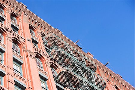 Fire escape on apartment building Stock Photo - Premium Royalty-Free, Code: 614-06624713