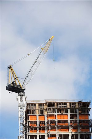 Crane over building in construction Stock Photo - Premium Royalty-Free, Code: 614-06624720
