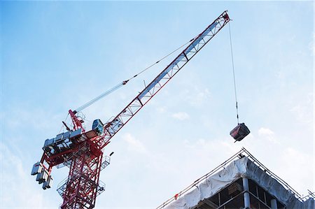 raised - Crane loading equipment on building Stock Photo - Premium Royalty-Free, Code: 614-06624737