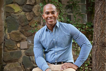 shaving (fragment) - Smiling man sitting outdoors Stock Photo - Premium Royalty-Free, Code: 614-06625056