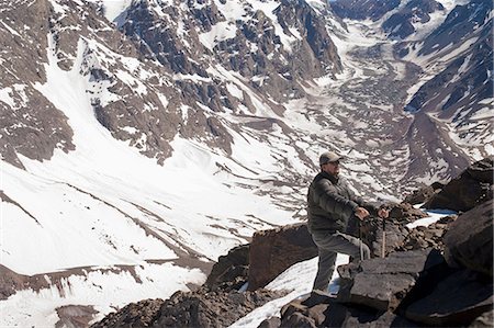 santiago, chile - Hiker walking on rocky mountainside Stock Photo - Premium Royalty-Free, Code: 614-06625128