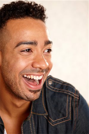 portrait young man white background - Close up of man's smiling face Stock Photo - Premium Royalty-Free, Code: 614-06625139