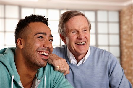Father and son smiling together Stock Photo - Premium Royalty-Free, Code: 614-06625192