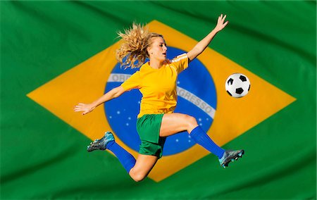 people of south americans - Brazilian soccer player by flag Stock Photo - Premium Royalty-Free, Code: 614-06625328