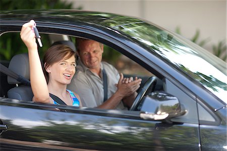 father teaching daughter to drive - Father giving teenage daughter new car Stock Photo - Premium Royalty-Free, Code: 614-06623407