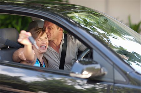 father teaching daughter to drive - Father giving teenage daughter new car Stock Photo - Premium Royalty-Free, Code: 614-06623408