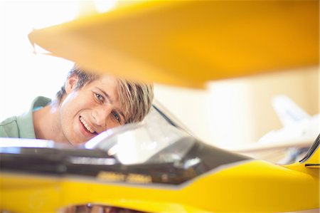 Man working on model airplane Stock Photo - Premium Royalty-Free, Code: 614-06623564