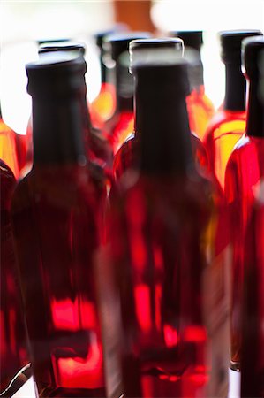 food product - Close up of vinegar bottles on shelf Stock Photo - Premium Royalty-Free, Code: 614-06623795