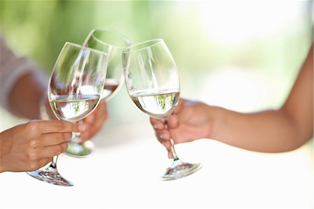 Friends toasting with wine outdoors Stock Photo - Premium Royalty-Free, Code: 614-06623884