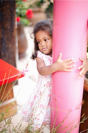 polish ethnicity (female) - Girl hugging pole outdoors Stock Photo - Premium Royalty-Free, Code: 614-06623899