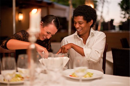 serving food at restaurant - Couple having dinner in restaurant Stock Photo - Premium Royalty-Free, Code: 614-06623977