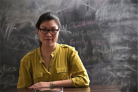 portrait chalkboard - Portrait of woman with digital tablet Stock Photo - Premium Royalty-Free, Code: 614-06718117