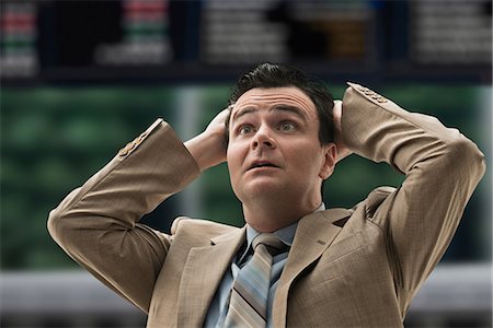 financial loss - Stressed businessman at stock exchange Foto de stock - Sin royalties Premium, Código: 614-06718147