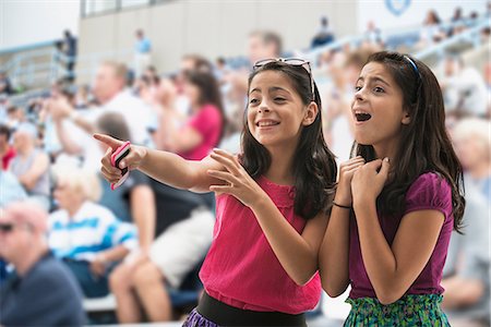 pointing at watch - Adoring girls at pop concert Stock Photo - Premium Royalty-Free, Code: 614-06718156