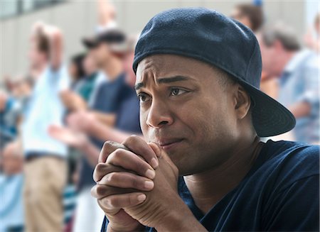 Tense man at sports game Photographie de stock - Premium Libres de Droits, Code: 614-06718168