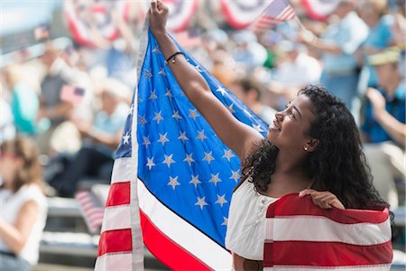 Girl at rally holding up american flag Stockbilder - Premium RF Lizenzfrei, Bildnummer: 614-06718160