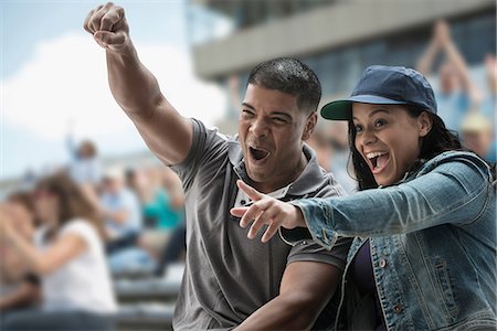 successful couple - Excited couple at sports game Stock Photo - Premium Royalty-Free, Code: 614-06718186