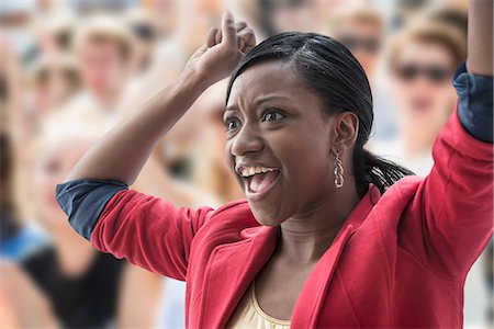 sport crowd cheering - Excited woman in crowd Stock Photo - Premium Royalty-Free, Code: 614-06718202