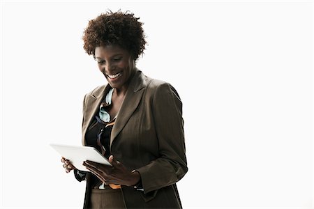 smile woman white background - Businesswoman holding digital tablet Stock Photo - Premium Royalty-Free, Code: 614-06718226