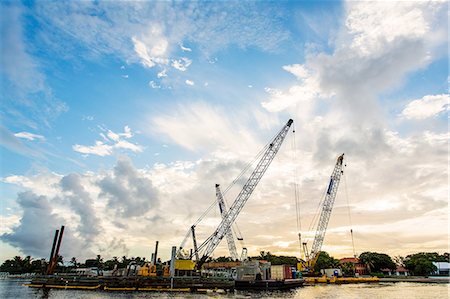 Construction cranes on waterfront Stock Photo - Premium Royalty-Free, Code: 614-06718262