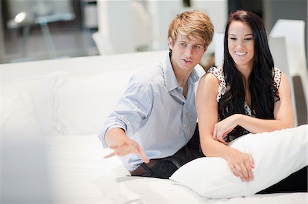 female happy shopper - Couple shopping for mattress in store Stock Photo - Premium Royalty-Free, Code: 614-06718348