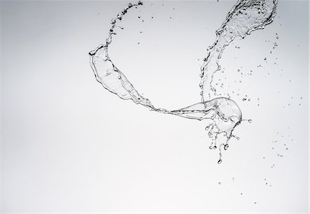 drop splash - Water splashing in air Stock Photo - Premium Royalty-Free, Code: 614-06718354