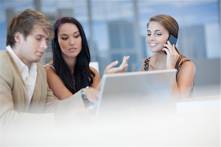 Business people talking at desk Stock Photo - Premium Royalty-Free, Code: 614-06718429