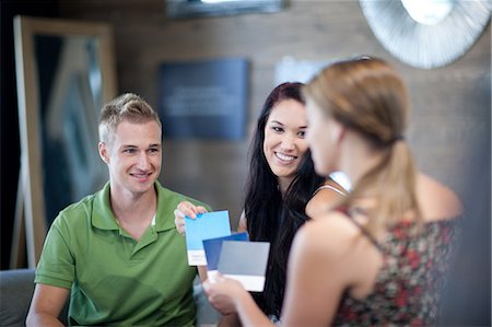 shop store furniture - Couple examining swatches in store Stock Photo - Premium Royalty-Free, Code: 614-06718421