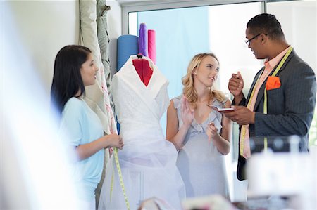 dress fitting - Dressmakers working with client Stock Photo - Premium Royalty-Free, Code: 614-06718505